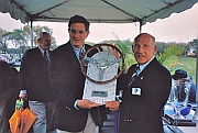 Bill Warner and Stirling Moss admiring R&T Magazine’s “The Car We Would Most Like To Drive” trophy designed and hand-fabricated by Dwight H. Bennett for the first Amelia Island Concours d’Elegance.